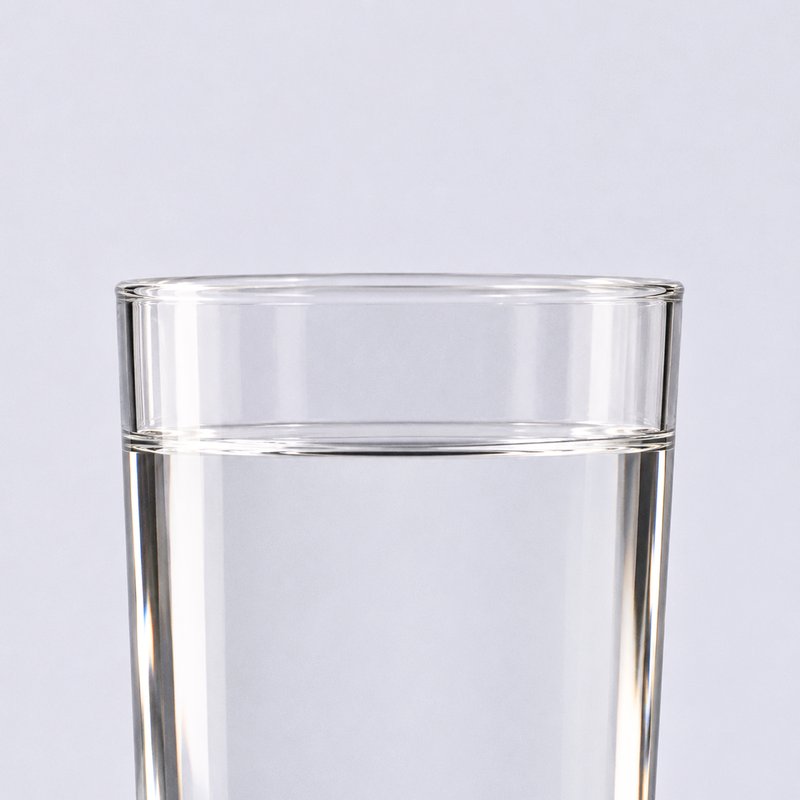 A glass of water on a pale background